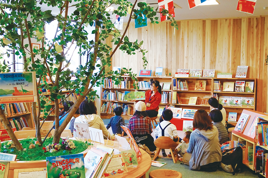 Reading aloud to a group of children