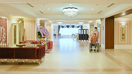 A chandelier hangs from the ceiling of the first-floor elevator hall.