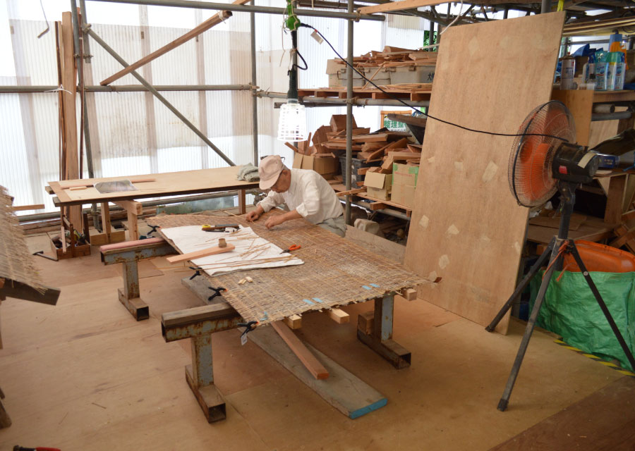 Sukiya-zukuri style carpenter repairing the basket-weave ceiling