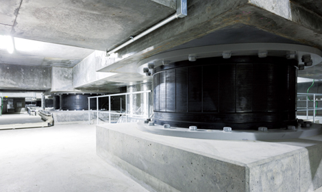 Seismic isolation system coupled with a building safety diagnostic system in the Shimizu head office building that determines whether it is safe to use the building immediately after an earthquake