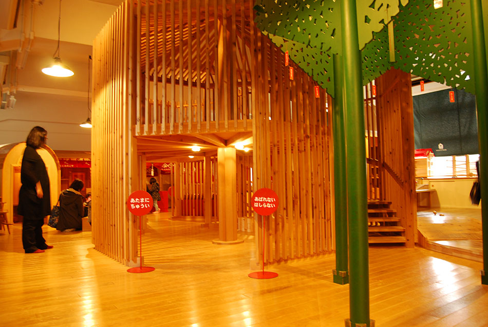 A forest of toys filled with wooden playground equipment