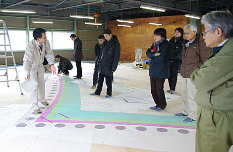 During production of the full-scale drawing. The client and the designer worked together on it.