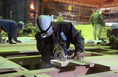 The Japanese cypress-wood floor is laid with masterful skill, plank by plank.